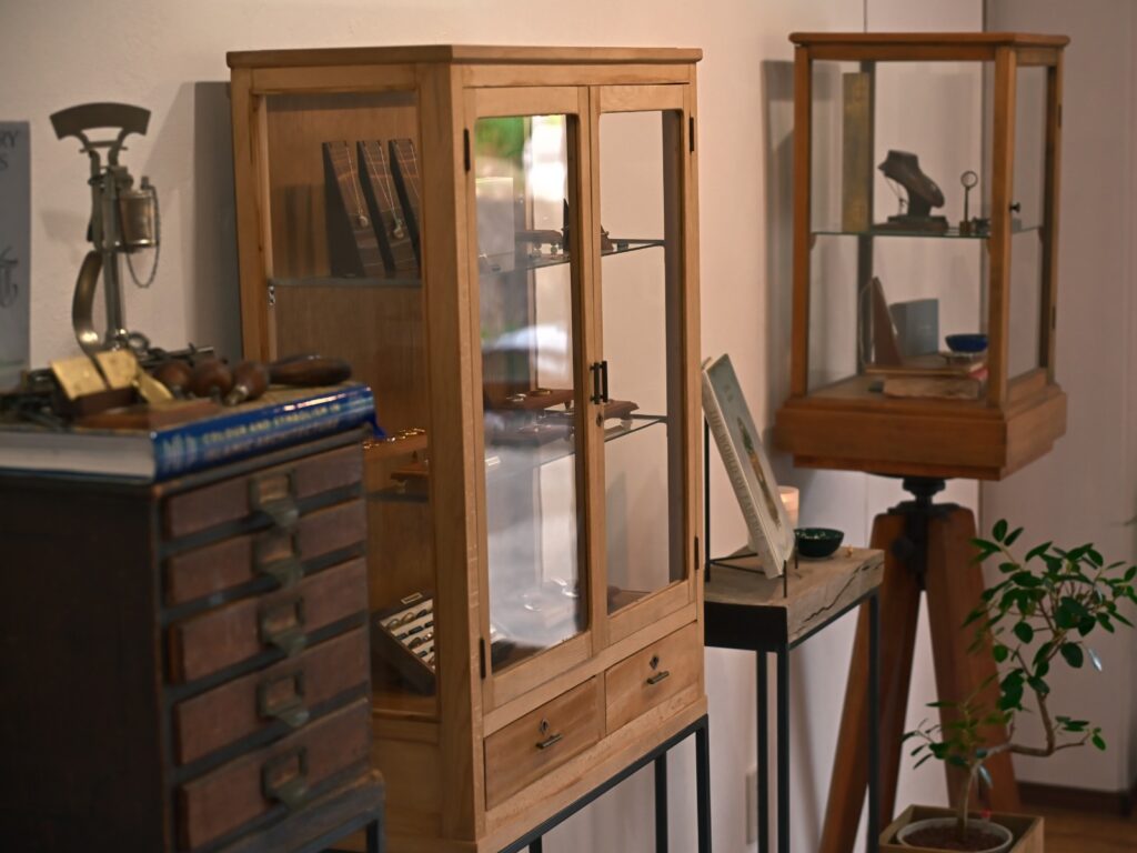 Jewellery display in an antique cabinet at Journey studio