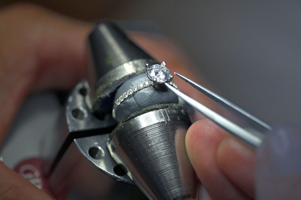 Diamond stone setting for a bespoke engagement ring during the jewellery-making process