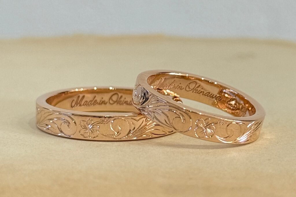 Custom-made Hawaiian jewellery wedding bands in rose gold with hand-engraved details