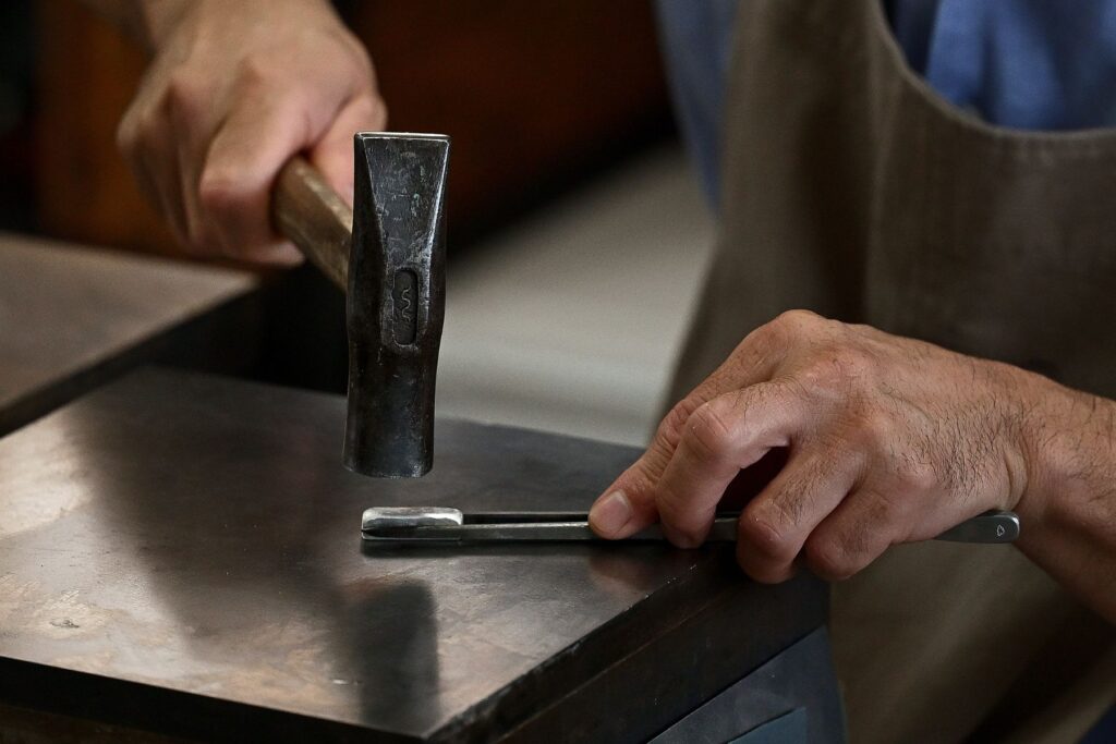 Forging metal for bespoke jewellery and wedding band production using traditional techniques