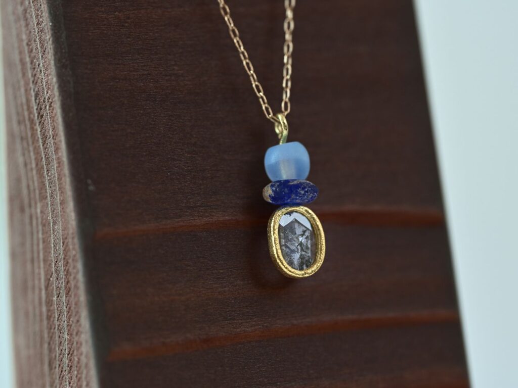 Primitive necklace featuring a slice diamond, beach glass and beads