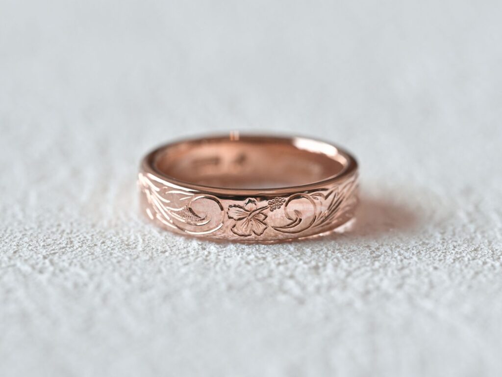 Rose gold Hawaiian ring featuring a hibiscus motif