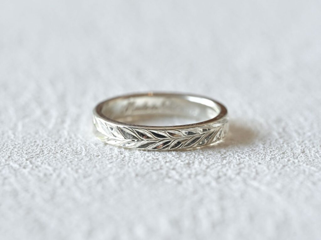 Platinum Hawaiian ring featuring a Maile leaf motif