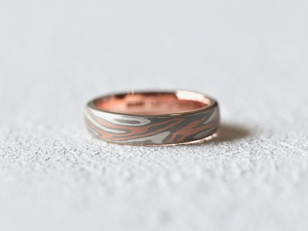 Classic Two Tone Mokumegane ring featuring rose gold and silver woodgrain patterns