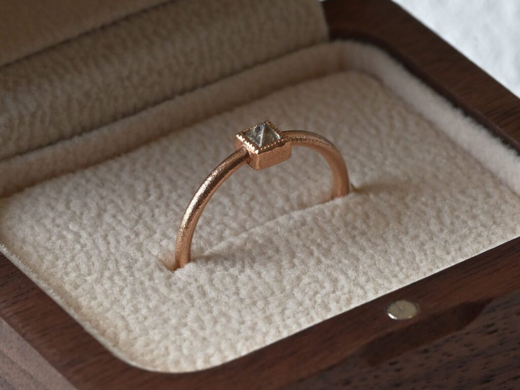 Primitive ring featuring a white rough diamond set in 18K rose gold