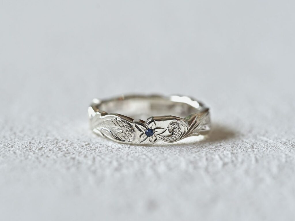 Platinum Hawaiian ring featuring a sapphire
