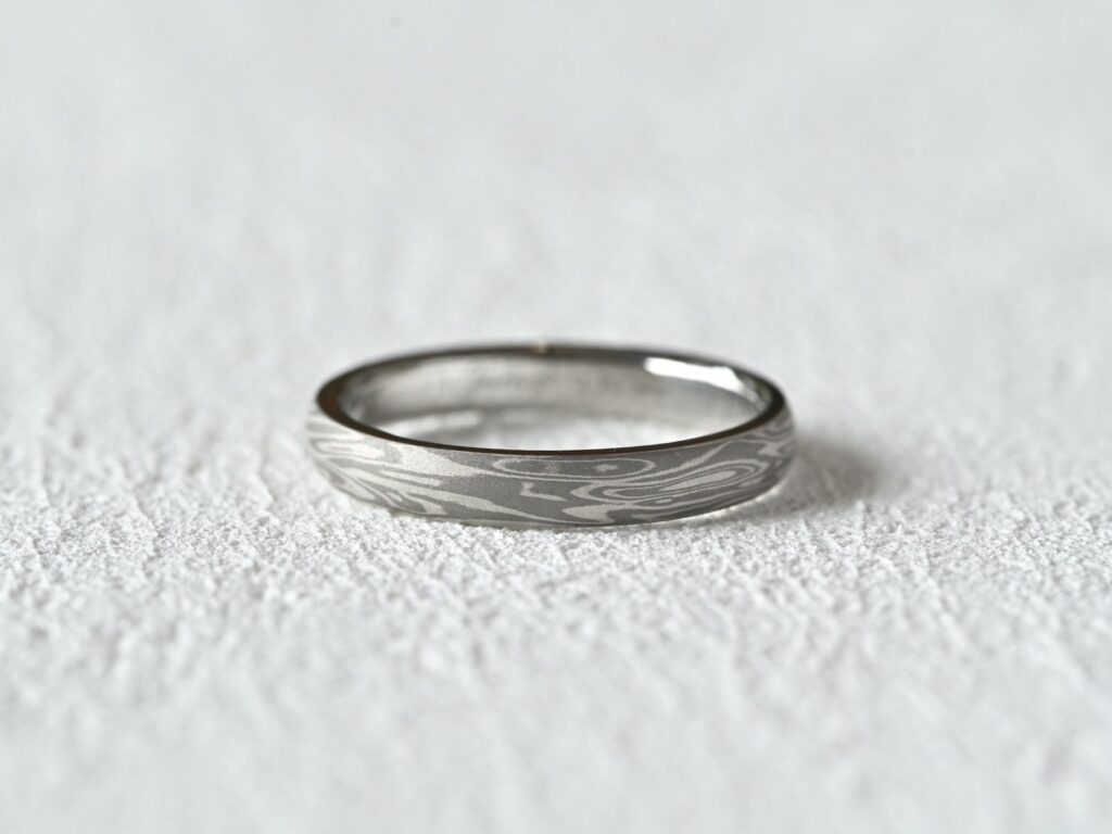 Classic Two Tone Mokumegane ring featuring delicate silver-grey woodgrain patterns