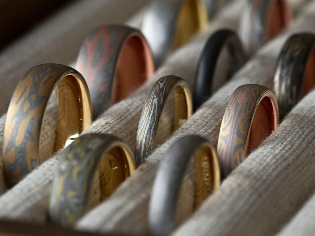 Mokumegane wedding band and bespoke ring samples featuring unique woodgrain patterns