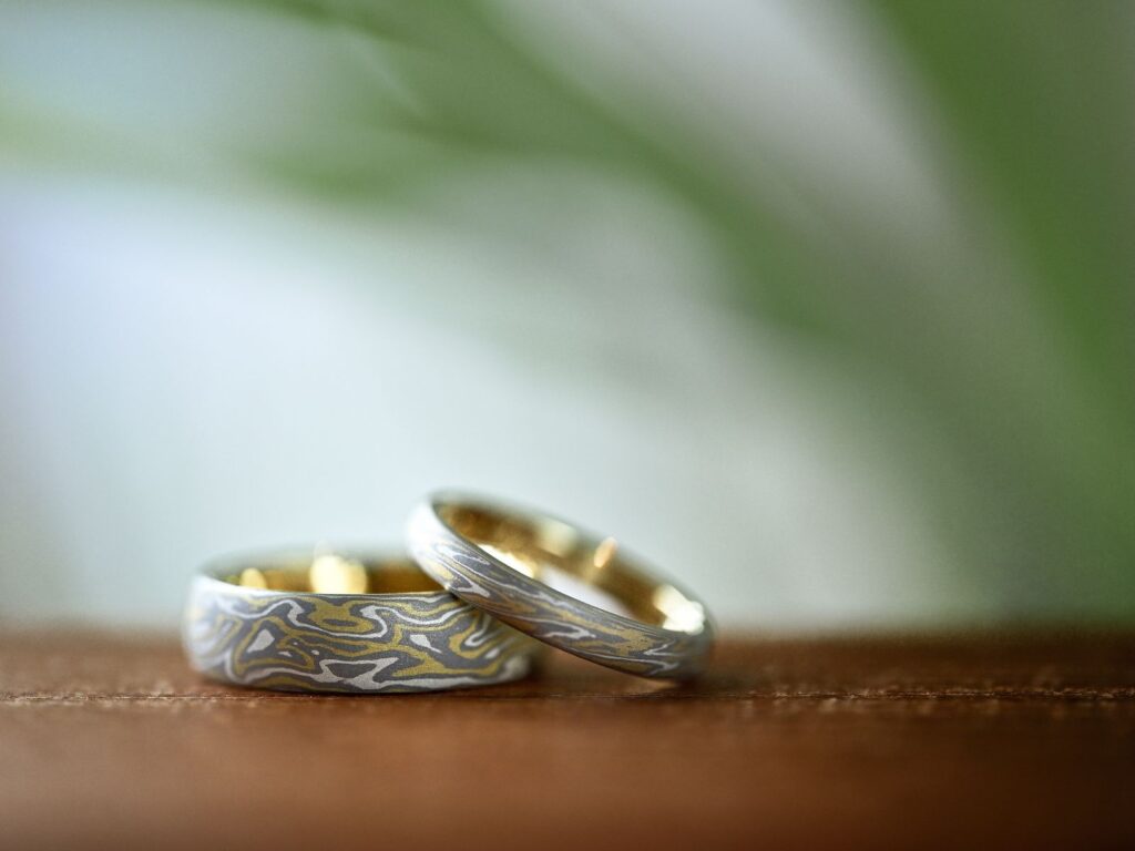 Custom-made Mokumegane wedding bands with distinctive woodgrain patterns