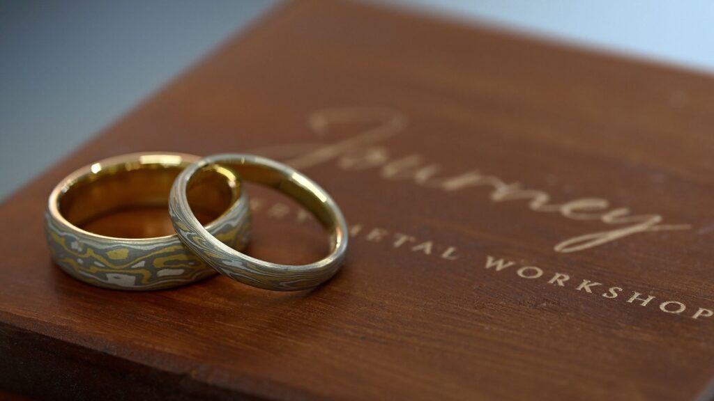 Custom-made Mokumegane wedding bands with distinctive woodgrain patterns
